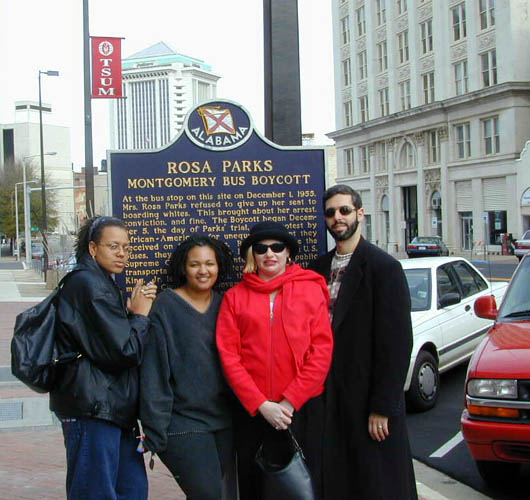 Four SGI-USA members stand by Rosa Parks historical marker.